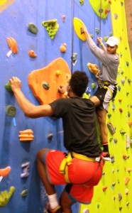 Two students on rock climbing wall