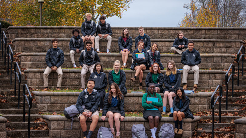 students sitting on steps